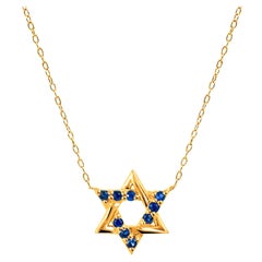 Collier pendentif toile de David en or 18 carats avec saphir bleu et diamants
