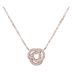 Collier pendentif nœud d'amour en or 18 carats avec pendentif en diamants