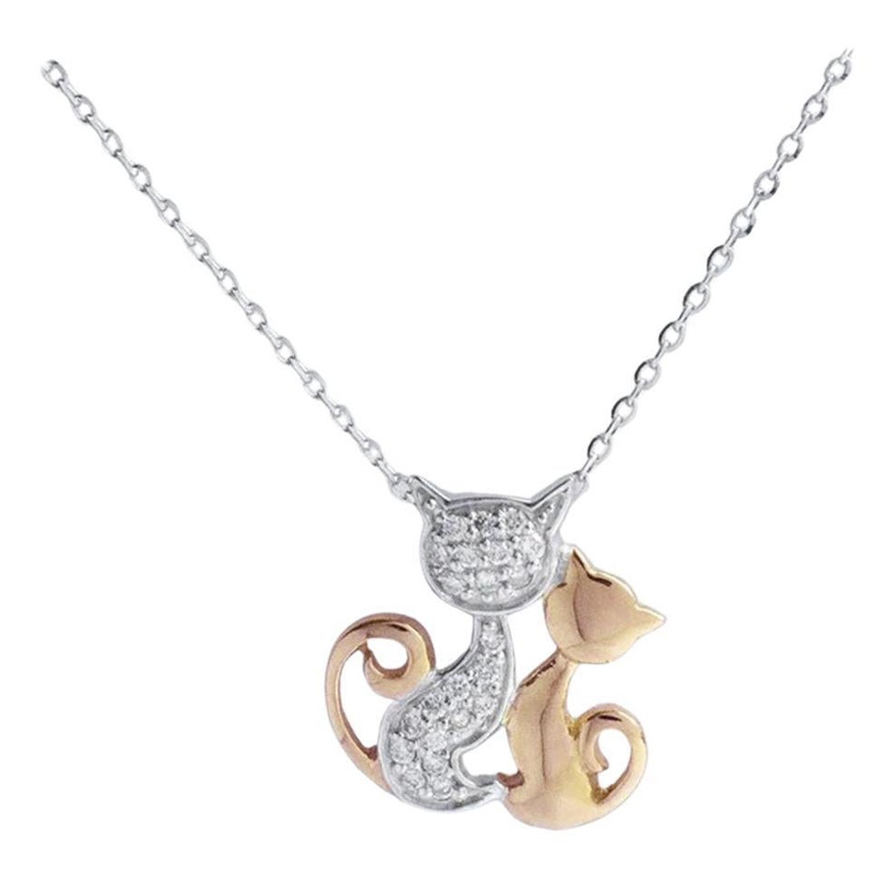 Diamant-Katzen-Charme-Halskette aus 14k Weiß- und Roségold.

Zarte, minimalistische Halskette aus massivem 14-karätigem Gold. Natürlicher, echter, rund geschliffener Diamant - jeder Diamant wird von mir von Hand ausgewählt, um die Qualität zu