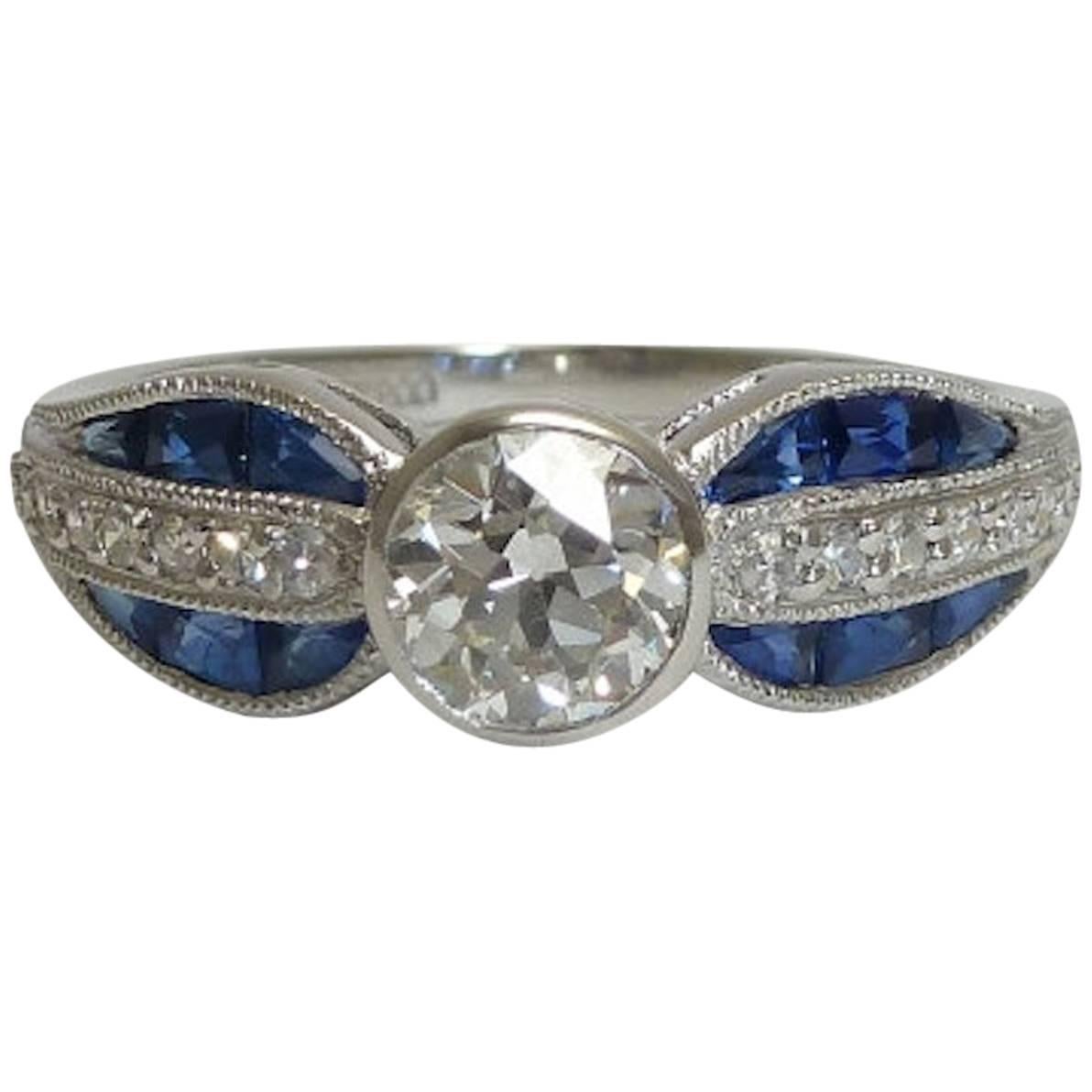 Handmade Sapphire, European Cut Diamond Bow Ring in Platinum For Sale