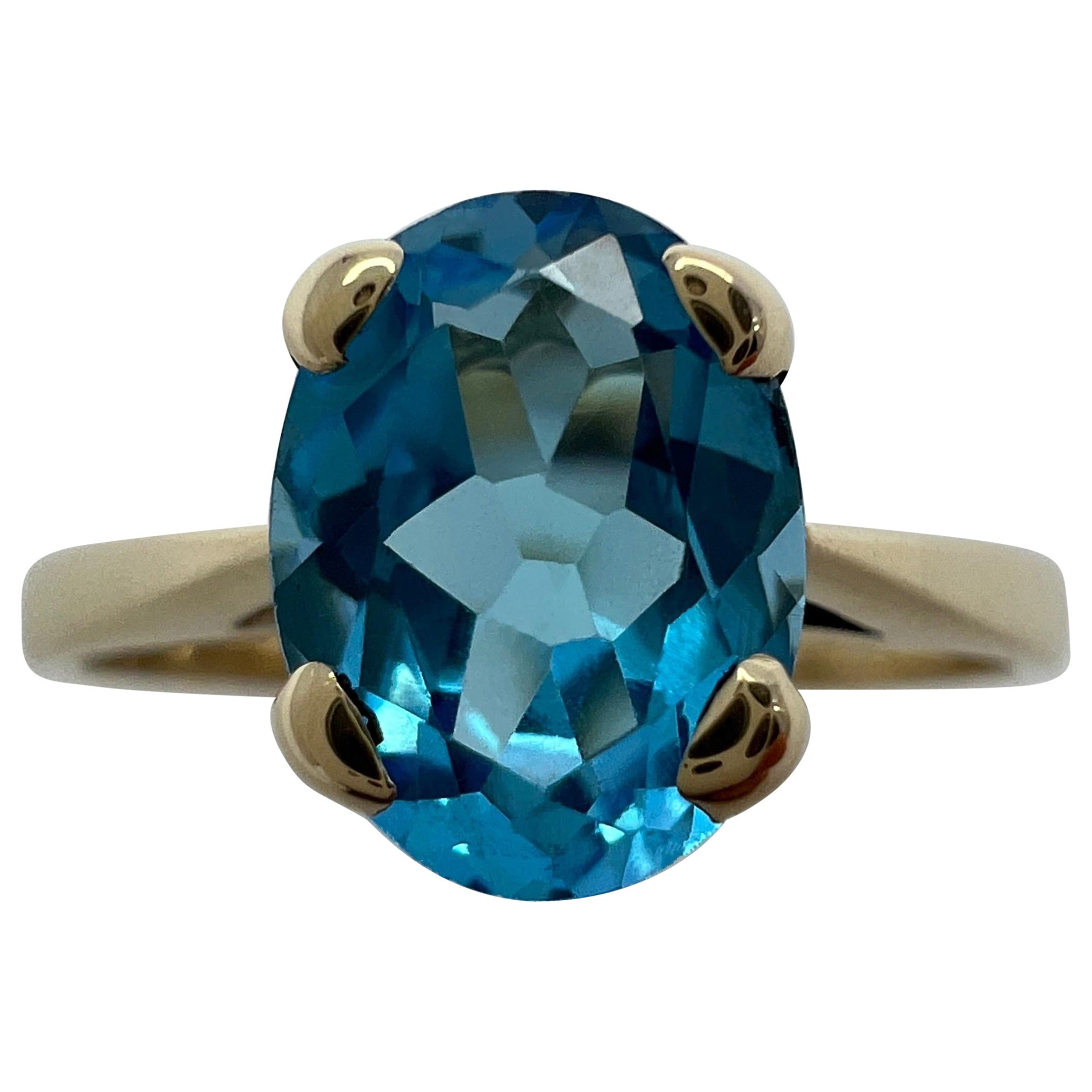 1.50 Carat Swiss Blue Topaz Oval Cut Yellow Gold Solitaire Ring For Sale