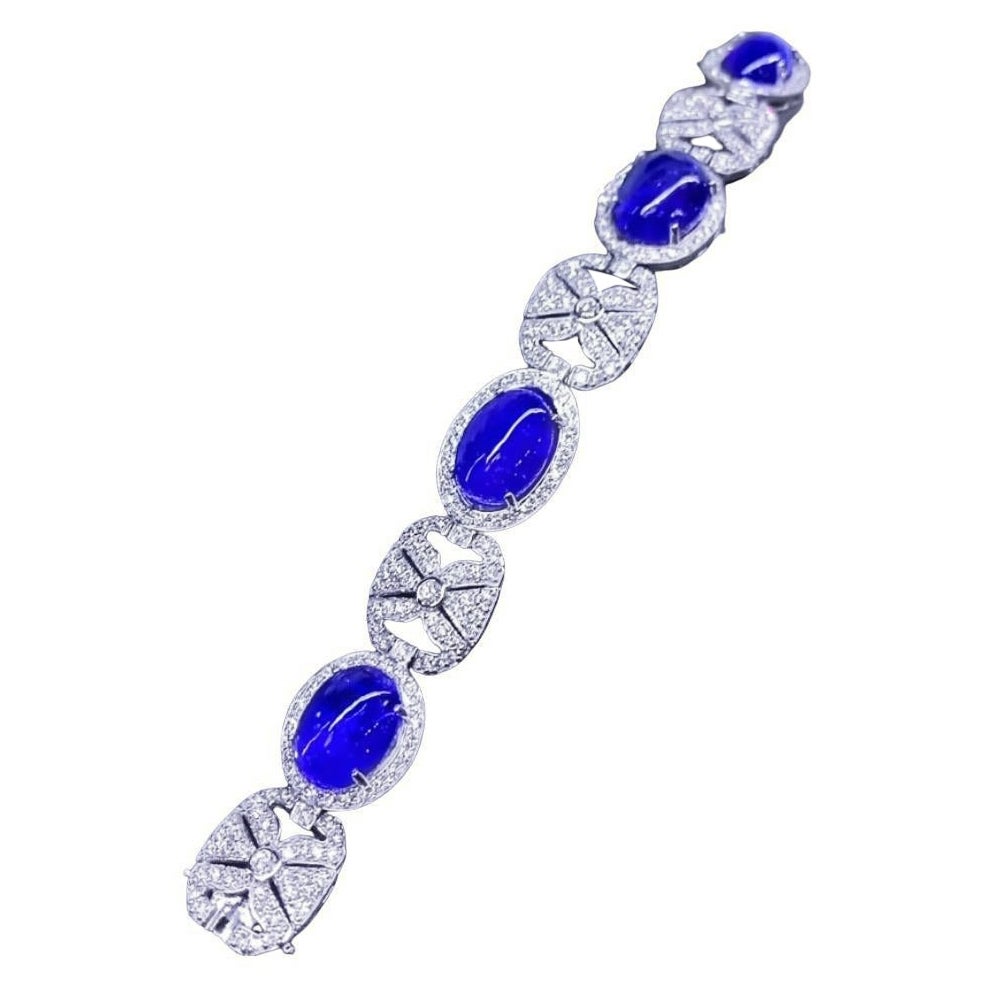 Gorgeous 62, 90 Carats of Tanzanites and Diamonds on Bracelet in Gold For Sale