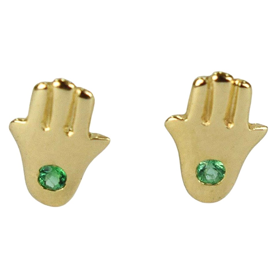 Tiny Hamsa Hand Earrings in 18k White Gold, Rose Gold, Yellow Gold.
These Dainty Stud Earrings are made of solid 18k gold featuring shiny brilliant round cut natural Emerald gemstone set by master setter in our studio. Simple but unique, elegant and