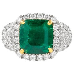 Alexander 3.26 Carat Emerald with Diamond Three Stone Halo Ring 18 Karat Gold