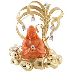 1970s Buddha Brooch Carved in Coral Set in Gold with Diamonds