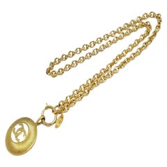 Chanel Gold-tone Metal CC Logo Cutout Sunburst Pendant Necklace