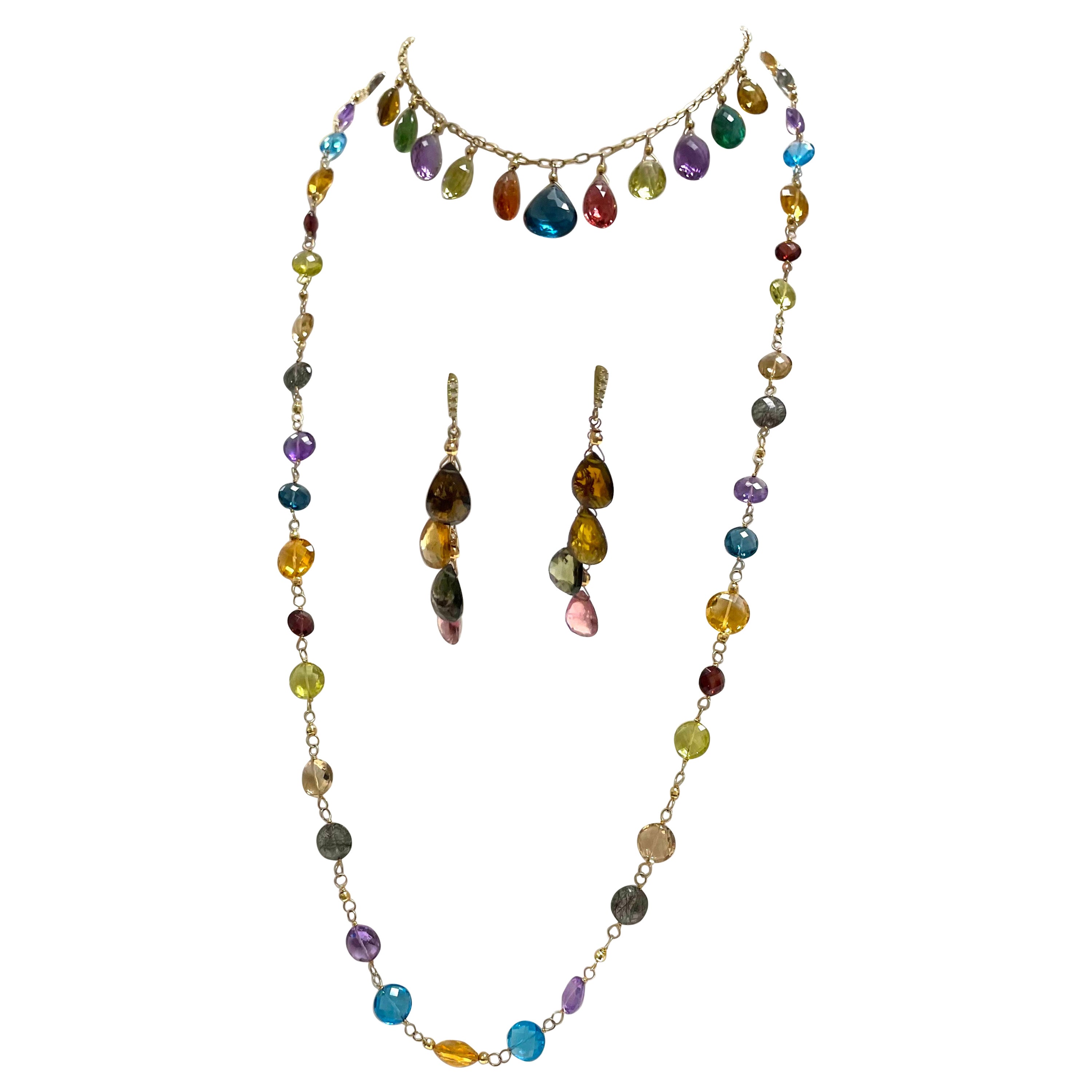 Description
Colorful Tourmaline adorned with a 14k yellow gold faceted ball playfully dangle from a chain suspended from a diamond post.
Item #E1900
Make a statement by adding a matching stunning short necklace (Item # N2272 $6,300) and long