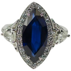 Platinring mit 6,18 Karat Saphir im Marquise-Schliff und Diamant