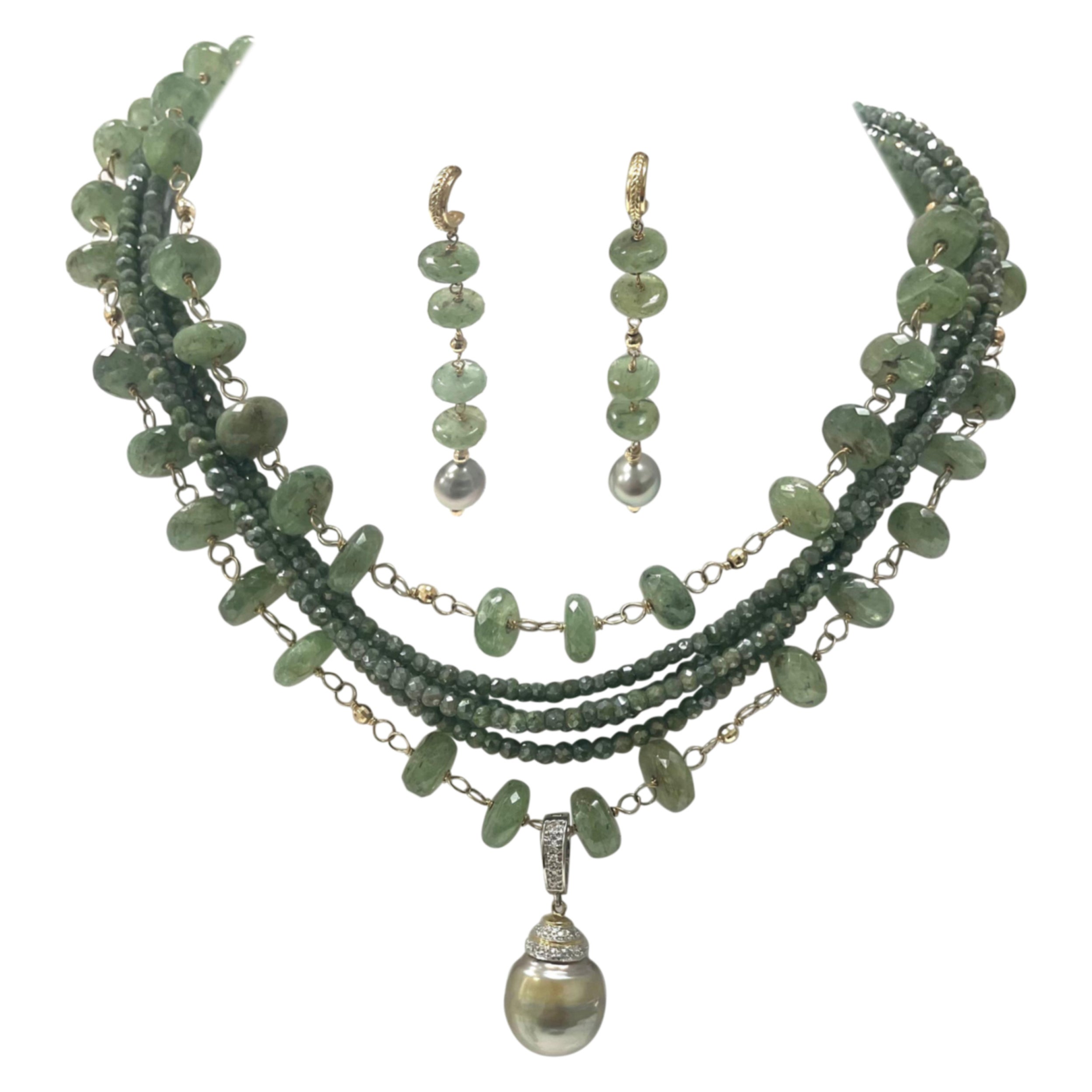 Description
Six strands of beautifully crafted and composed rare Green Kyanite and Moss Sapphire are adorned by a large Pistachio Tahitian Pearl capped with diamonds. The Tahitian pendant is removable and can be worn with other necklaces, however