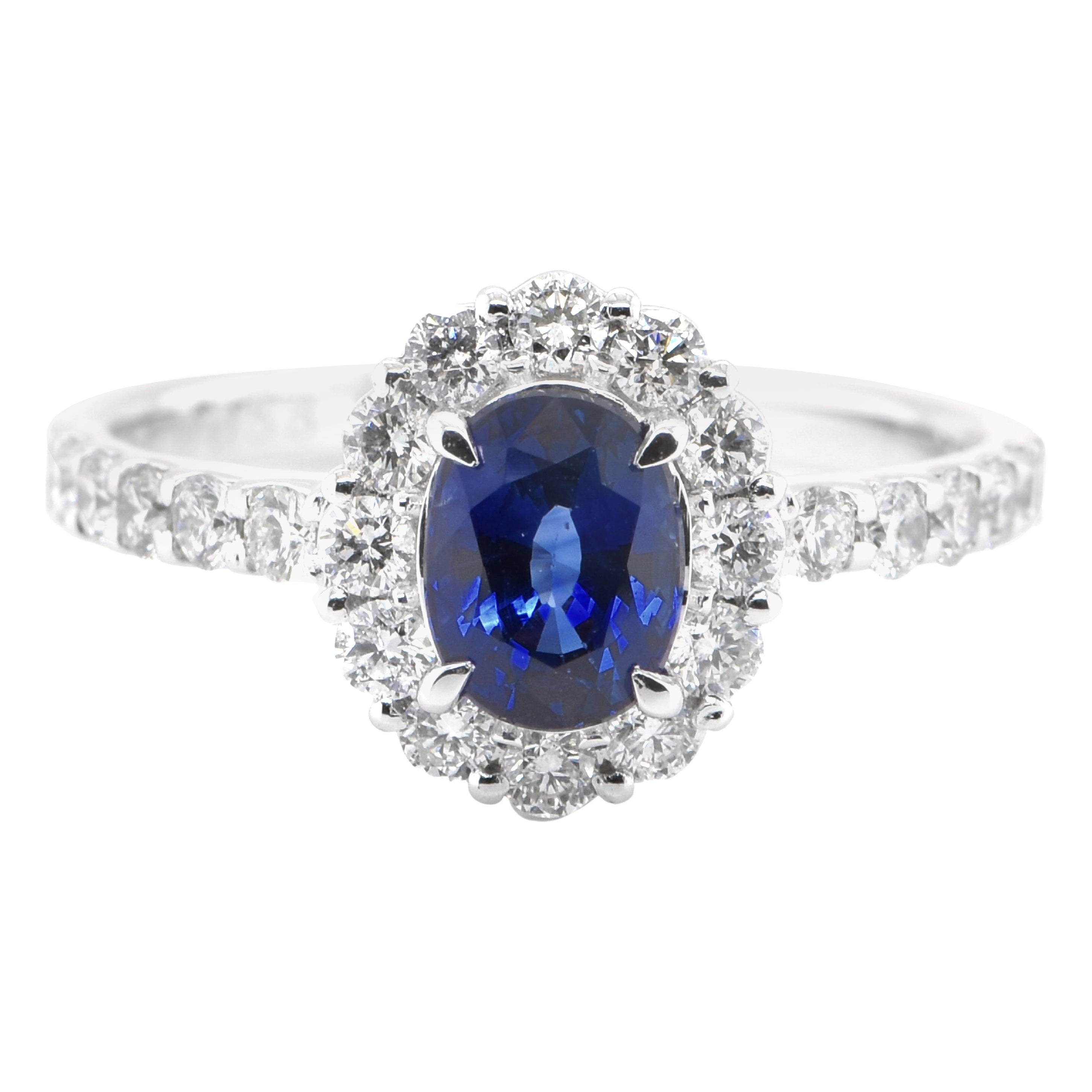 1.00 Carat Natural Sapphire and Diamond Halo Ring Set in Platinum For Sale