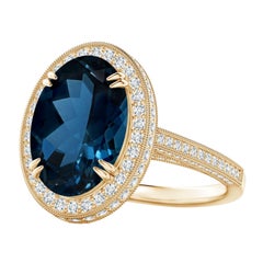 Angara Anello aureola in oro giallo con Topazio Blu di Londra certificato GIA e lavorazione a grana fine