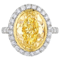 GIA Certified 5.12 Ct Fancy Yellow Oval Diamond Engagement Ring in Platinum