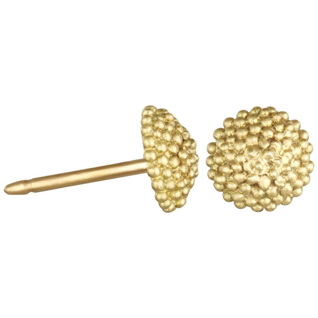 Faye Kim's 18k gold* mini granulation gold stud earrings are slightly domed and textured.
The perfect complement to large statement pieces or on days when you just want a little something to pull it all together!  
*Faye Kim's signature green gold