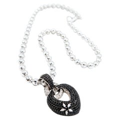 Black and White Diamond Pavé Knotted Heart Pendant on Faceted 18K Gold Chain