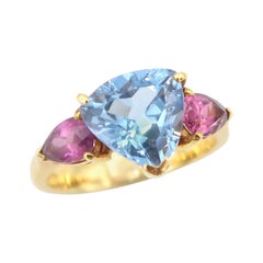 Three-Stoned Blue Topaz Flanked with Pink Tourmaline Yellow Gold Ring