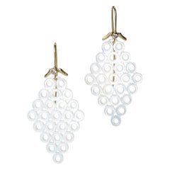 Carved mother-of- pearl connected circles with 18k yellow gold and diamonds