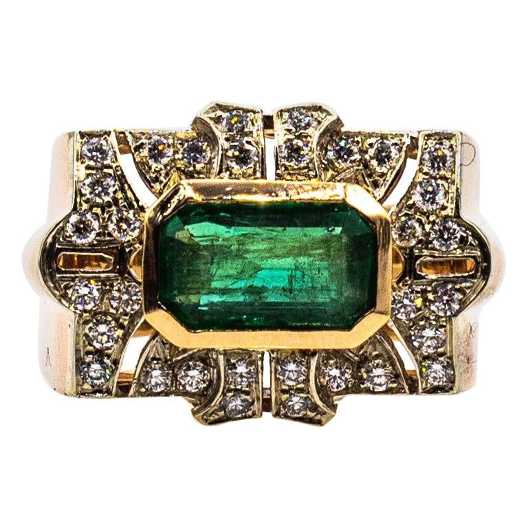 This Ring is made of 14K White Gold and 14K Yellow Gold.
This Ring has 0.38 Carats of White Modern Round Cut Diamonds.
This Ring has a 1.74 Carats Natural Emerald Cut Emerald.
This Ring is inspired by Art Deco.

Size ITA: 16 USA: 7 1/2

We're a