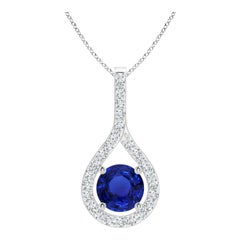 Colgante de oro blanco con zafiro azul natural y diamante certificado por el GIA de Angara
