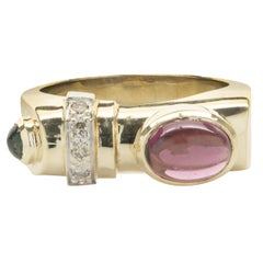 Geometrischer Ring aus 14 Karat Gelbgold mit Diamanten und rosa / grünem Turmalin