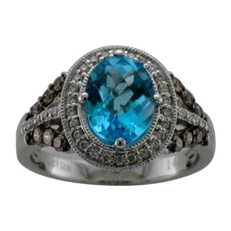 Großer Sale-Ring mit blauem Topas und schokoladenbraunen Diamanten