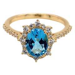 Oval Natural Swiss Blue Topaz And CZ Yellow Gold Over Sterling Silver Ring