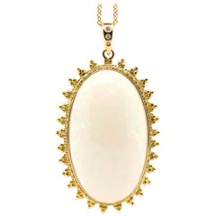 44.60 Carat Oval Shaped Opal and Diamond Pendant 18 Karat Yellow Gold