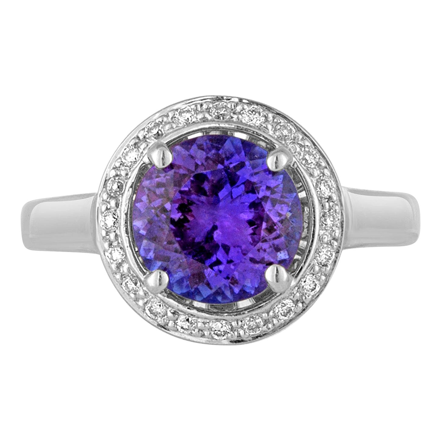 Bague en or avec halo de 2,00 carats de tanzanite ronde et de diamant en vente