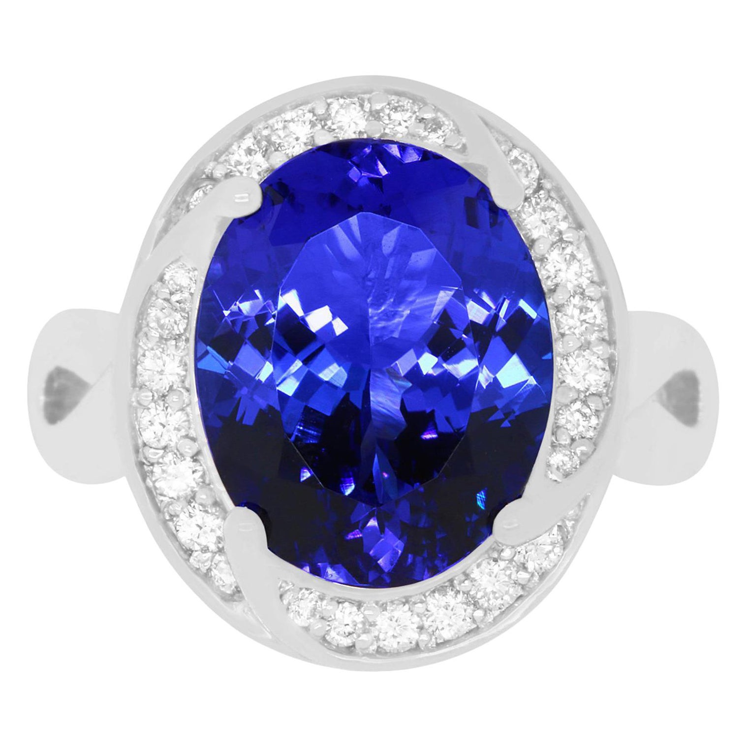 6.31 Carat Oval Shaped Tanzanite and 0.31 Carat White Diamond Ring For Sale