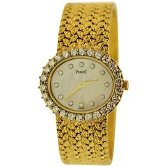 Piaget Yellow Gold Diamond Mother of Pearl Dial Diamond Bezel Quartz Wristwatch