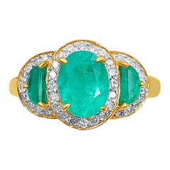 Vintage 1.60 Carat Oval Cut Colombian Emerald, Diamond, and 18K Yellow Gold Ring
