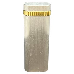 A “Les Must De Cartier Paris” Platinum mate finish & 18k gold plated lighter