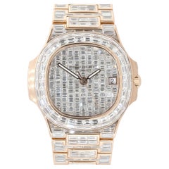 Patek Philippe Montre Nautilus en or rose 18 carats avec diamants baguettes, en stock