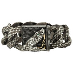 Taru Jewelry Bracelet serpent en or jaune et argent avec diamants et émeraudes