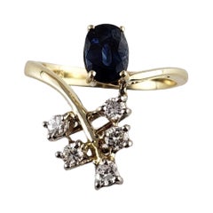 Anello con zaffiro naturale e diamante in oro giallo 14 carati