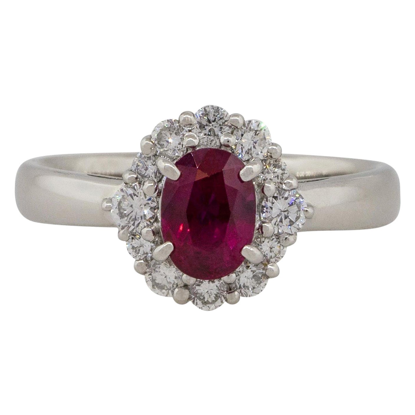 1.12 Carat Oval Ruby Center Diamond Halo Ring Platinum in Stock For Sale