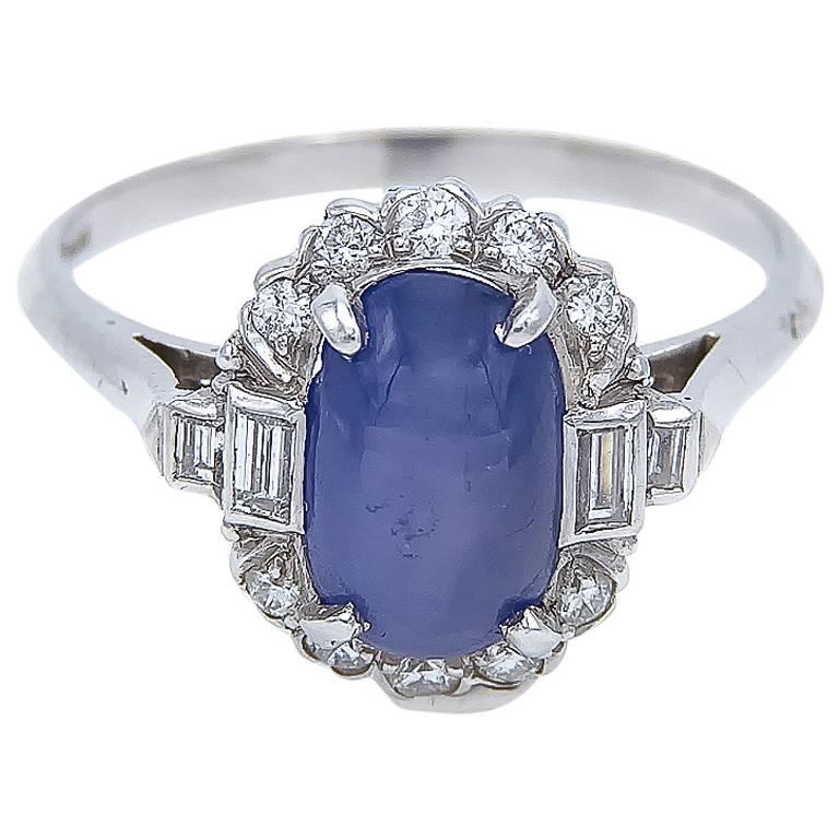 This stunning star sapphire ring has many unique elements that culminate into a gorgeous engagement ring or anniversary, birthday or any special occasion. The star in the sapphire is a bright blue and catches the light just perfectly. The ring is a