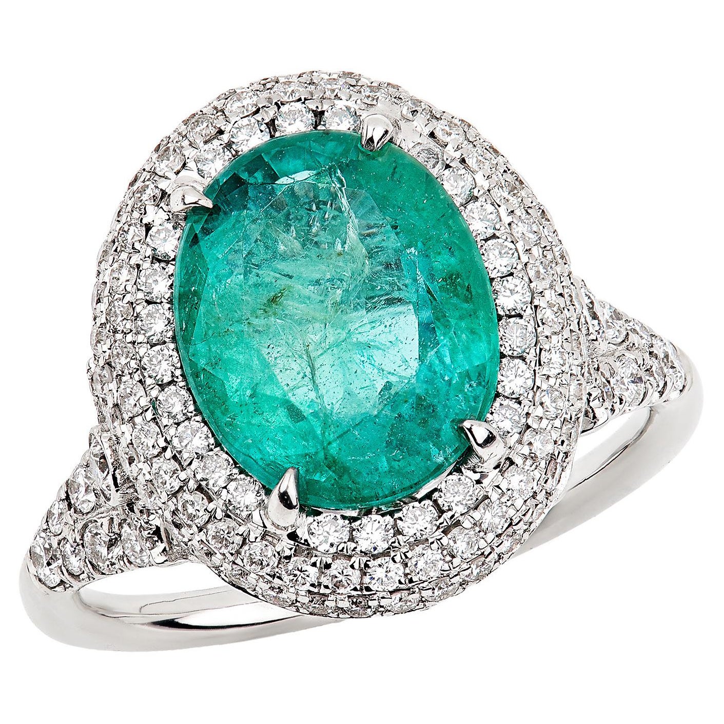 For Sale:  14K White Gold Oval Emerald And Double Halo Diamond Ring