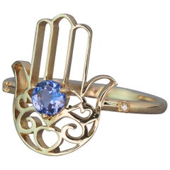 Gold Ring "Hamsa" Hand with Tanzanite in the Center and Diamonds