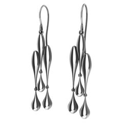 Boucles d'oreilles creuses en platine à trois gouttes d'eau