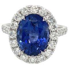 5.55 Carat Ceylon Sapphire & Diamond Halo Ring in 18 Karat White Gold