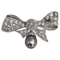 Edwardian 18 Karat Gold Old Cut Diamond Tahitian Pearl Bow Drop Pin Brooch