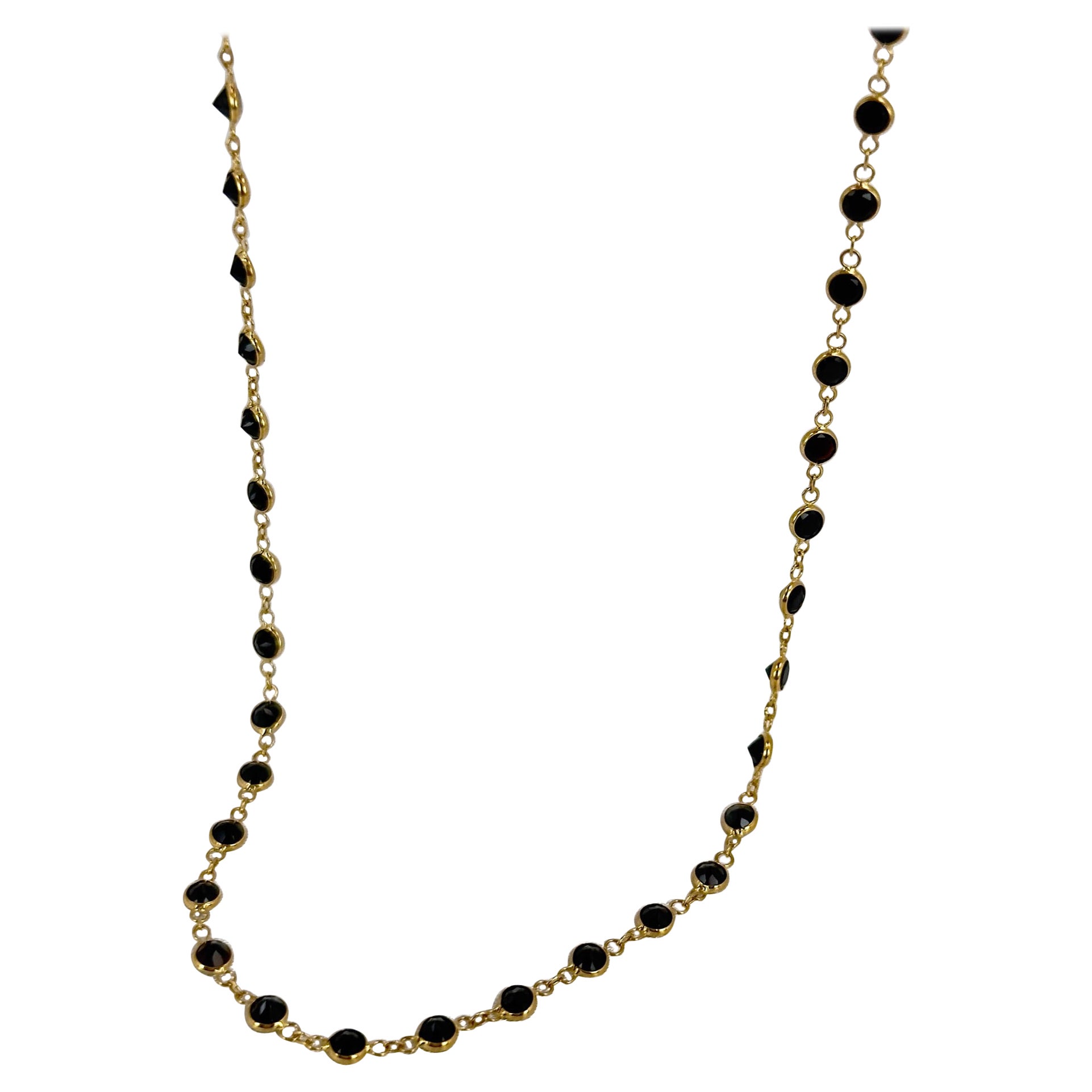 Our newest addition to the bezel set jewelry! The Black Spinel Necklace set in 18k solid Yellow gold! Beautiful round black Spinel, all in a unified color scheme, are set in the light weight and flexible bezel setting.

 The necklace is super