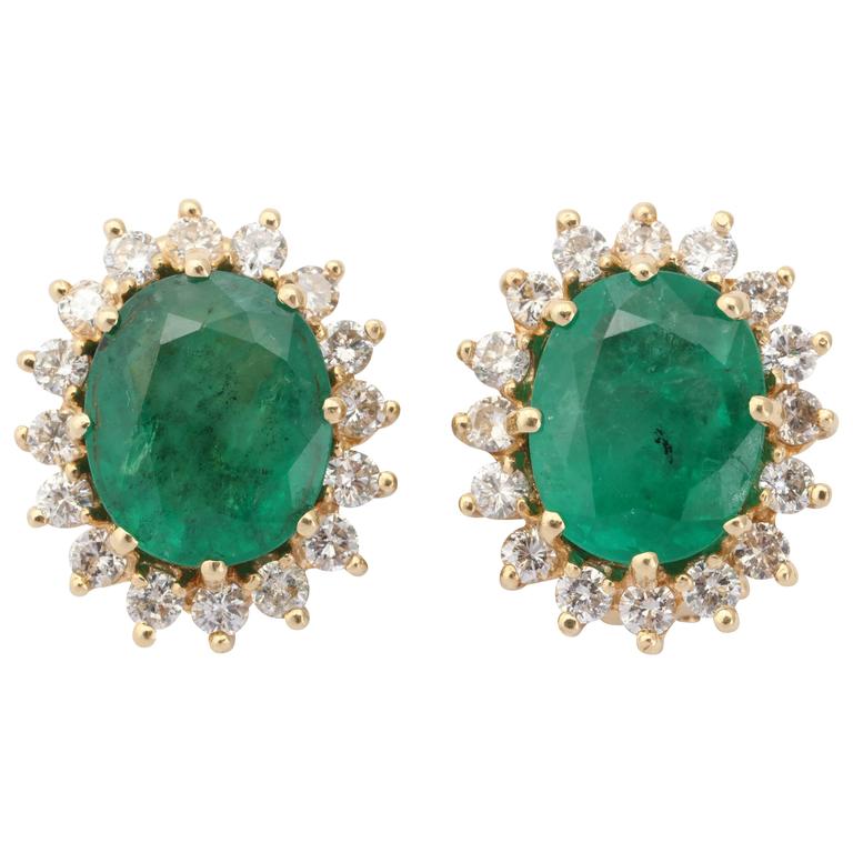 Oval Emerald Diamond Gold surround Earrings For Sale at 1stdibs