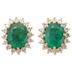 Oval Emerald Diamond Gold surround Earrings