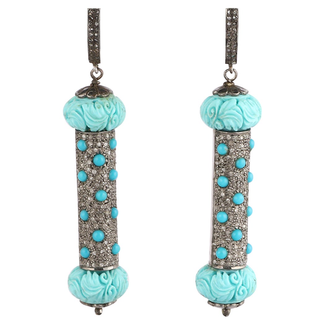 Boucles d'oreilles pendantes en argent avec diamants et turquoises de style victorien. 