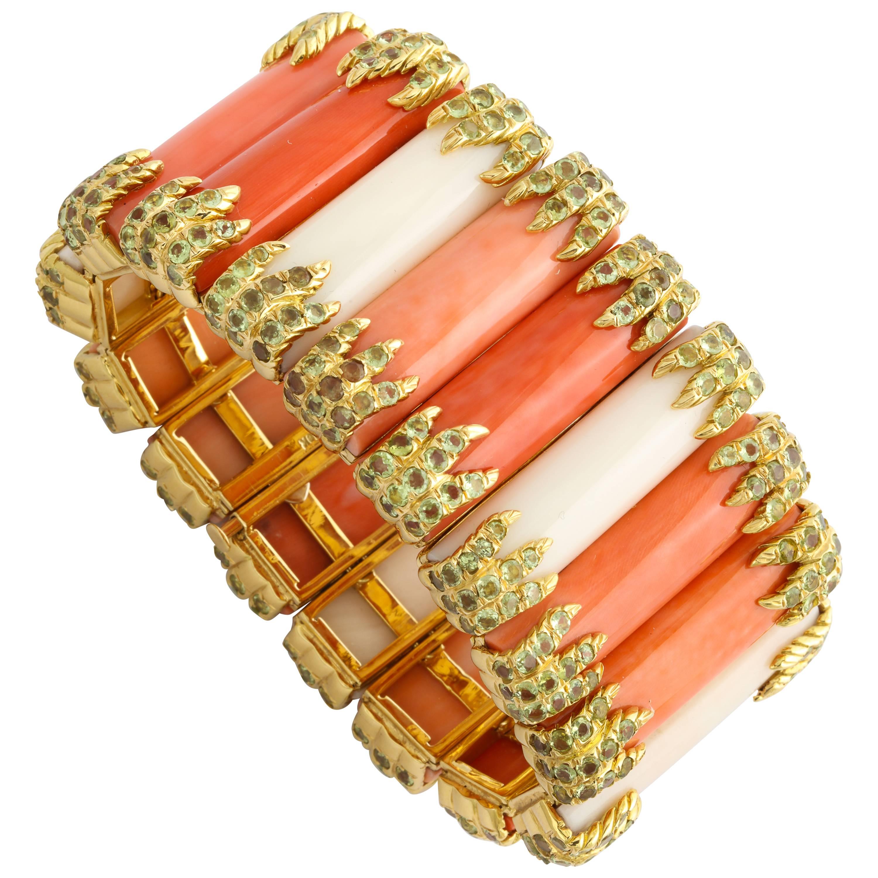 A beautiful and important one-of-a-kind Tony Duquette bracelet of 18K gold links holding long rounded sections of natural gem coral in various colors including: momo (salmon color from Sardinia); angel skin; and white, each section secured with 