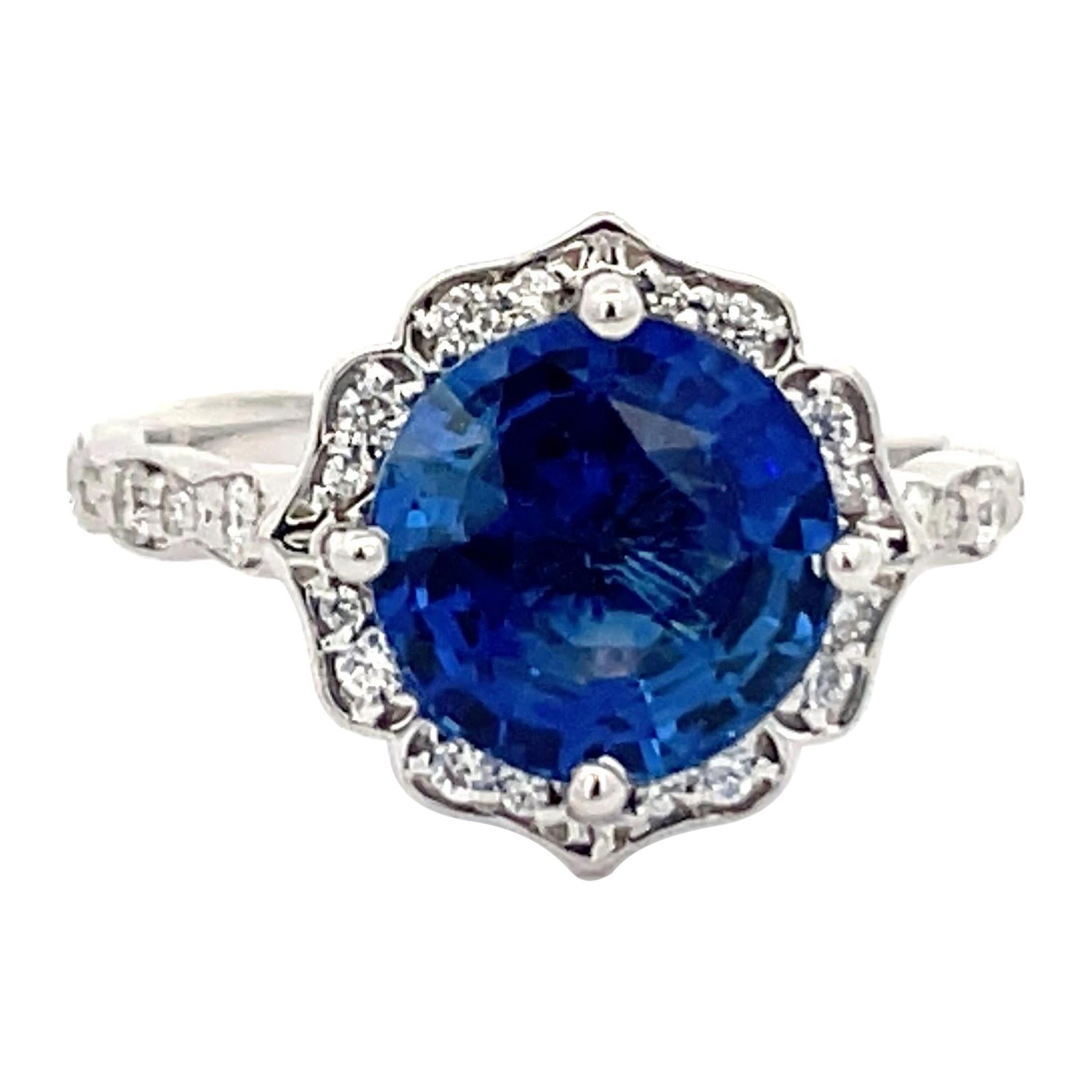 Antique Inspired Sapphire Diamond Halo Ring 4.07 Carats 14 Karat White Gold For Sale
