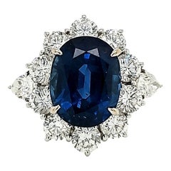 Used Blue Sapp Platinum Engagement Ring with Excellent Make Diamond Surround