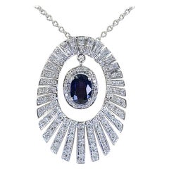 Collana con ciondolo a forma di stella in oro bianco, diamanti e zaffiri