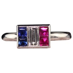 Antique Art Deco Platinum Art Carved Ruby Sapphire and Diamond Baguette Ring